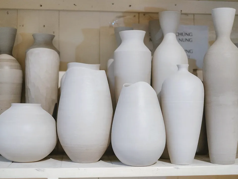 Row of ceramic vases on a shelf