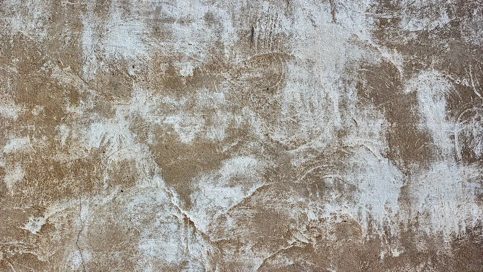 Close-up of a warm-toned hand-troweled plaster wall