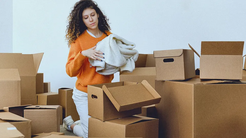 Unpacking moving boxes in a new home