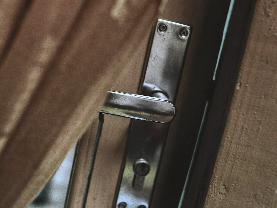 Close-up of a door latch and handle