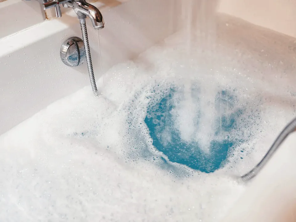 Bathtub water swirling toward the drain