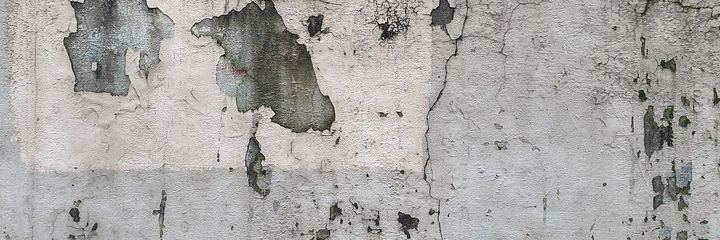 Curved plaster wall with a hairline crack