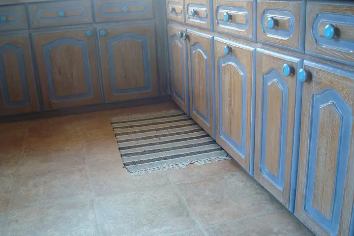Row of blue base cabinets along a kitchen wall