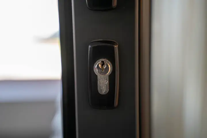 Detailed view of a steel keyhole on a door ensuring security and privacy