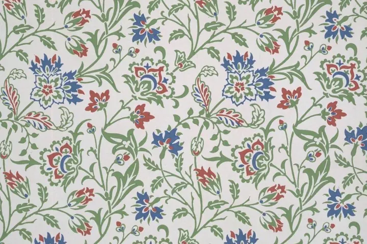 Old floral wallpaper sample in blue and green